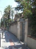 Villa gate with a memorial plaque