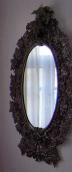 The mirror in carved frame
